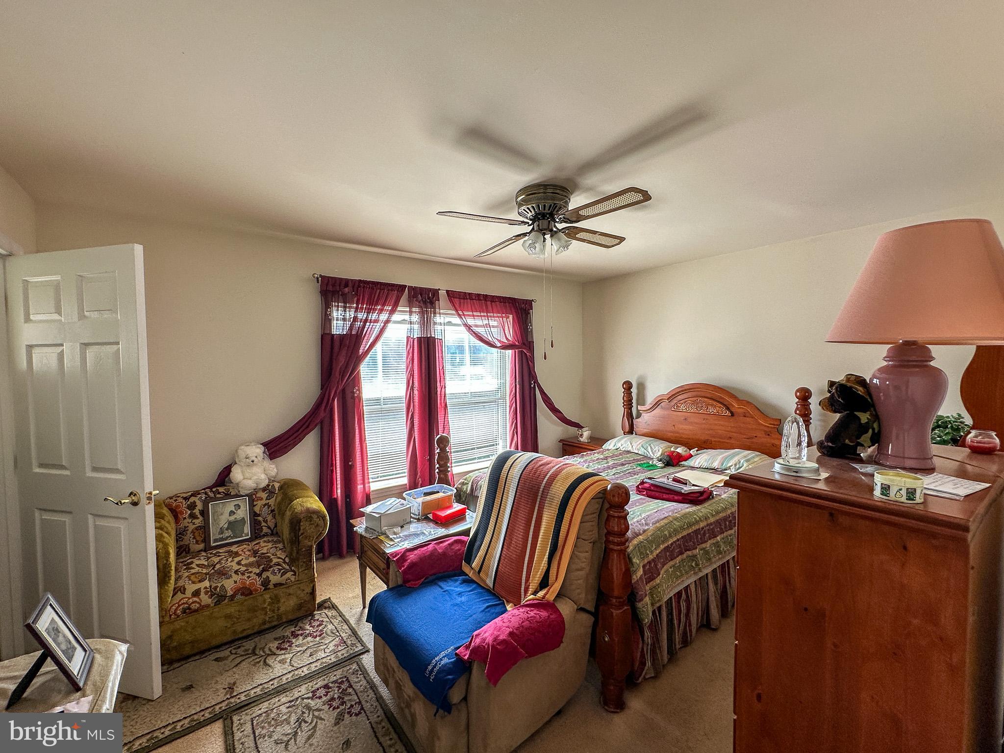 901 Merchant Street Coatesville, PA 19320 - Photo 18 of 36 a bedroom with furniture and a window