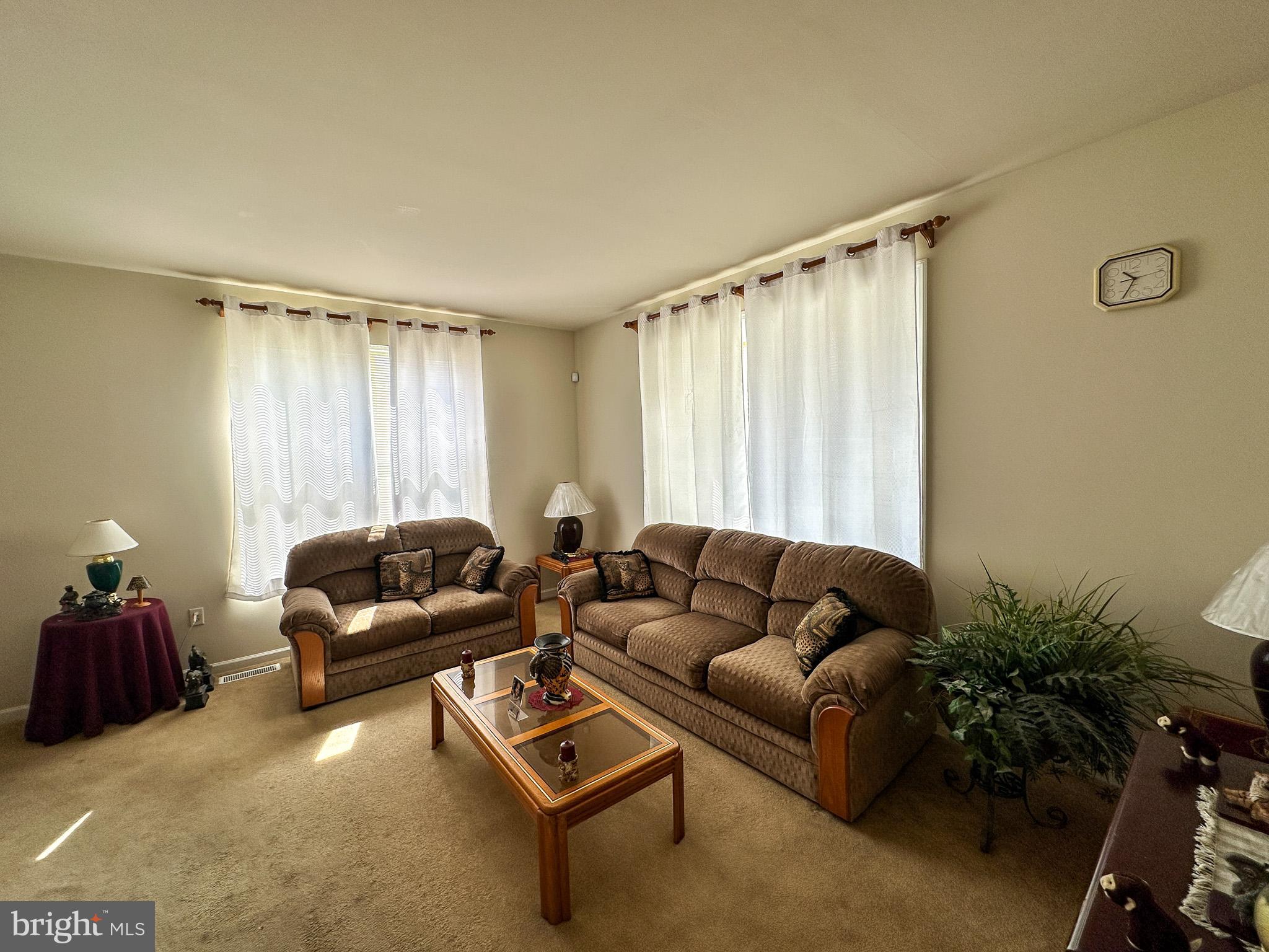 901 Merchant Street Coatesville, PA 19320 - Photo 34 of 36 a living room with furniture and a window