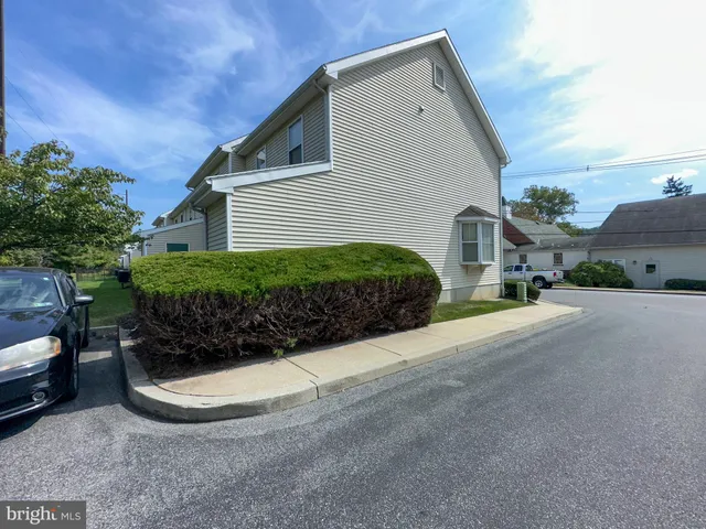 a view of a house with a street