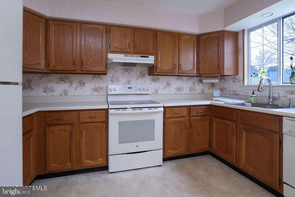 3B Alpine Road, Unit B Manchester Township, NJ 08759 - Photo 3 of 5 a kitchen with stainless steel appliances granite countertop a sink stove and cabinets
