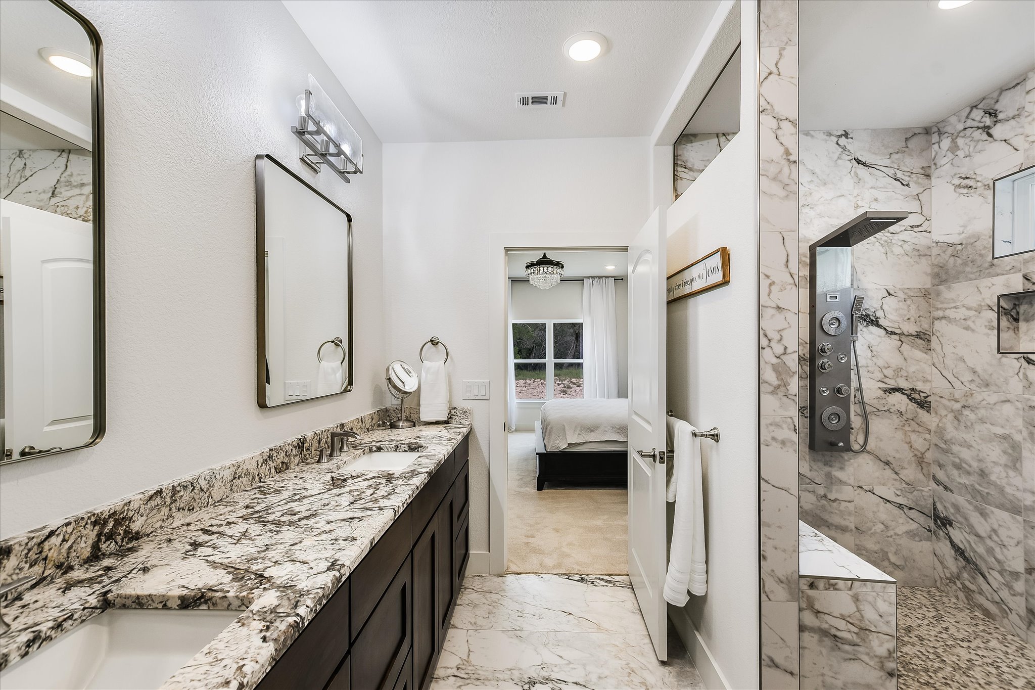 19920 Old Burnet Road Jonestown, TX 78645 - Photo 15 of 29 Master bathroom granite counters and large walk-in shower with programmable shower heads