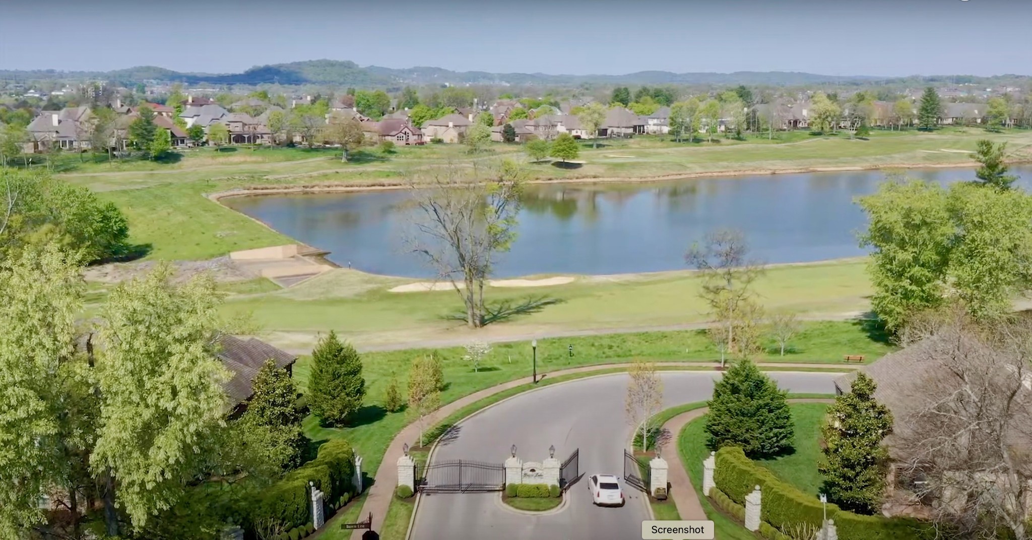 886 Fairington Way Gallatin, TN 37066 - Photo 16 of 22 an aerial view of a residential houses with outdoor space and a lake view