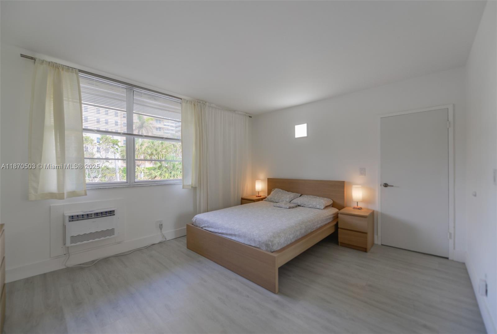 1936 South Ocean Drive, Unit 3C Hallandale Beach, FL 33009 - Photo 13 of 23 a bedroom with a bed and a window