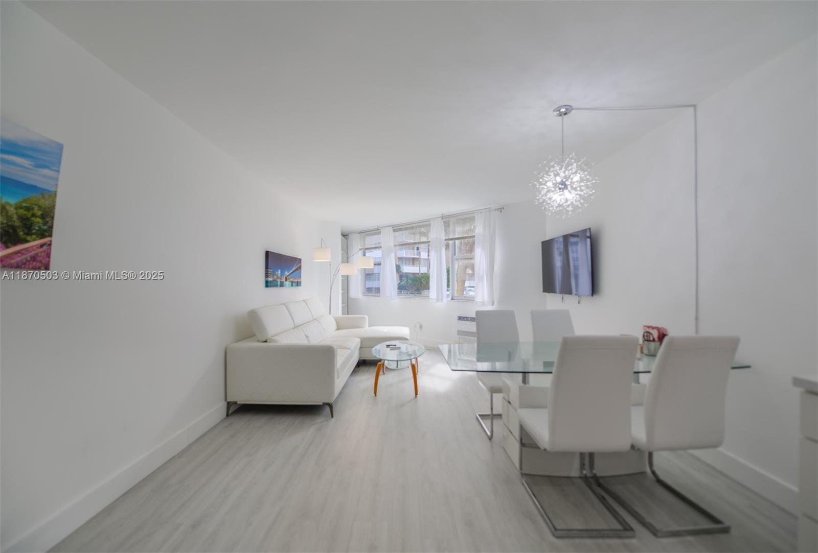 1936 South Ocean Drive, Unit 3C Hallandale Beach, FL 33009 - Photo 9 of 23 a living room with furniture and a table