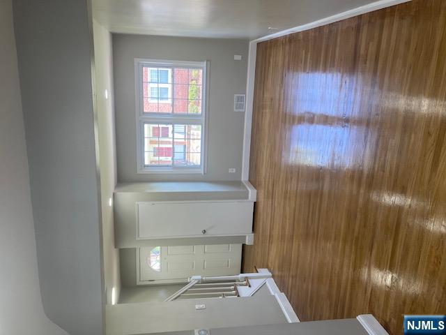 1288 Teaneck Road, Unit 3 Teaneck, NJ 07666 - Photo 1 of 17 a view of room with window and wooden floor