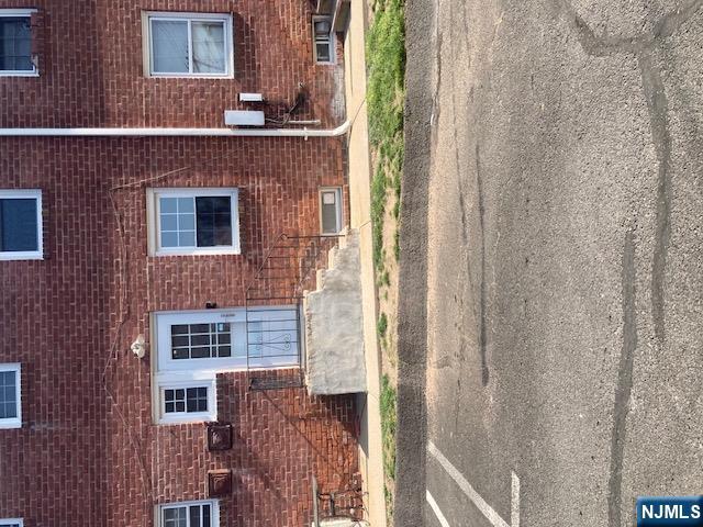 1288 Teaneck Road, Unit 3 Teaneck, NJ 07666 - Photo 17 of 17 a view of a brick house with a yard