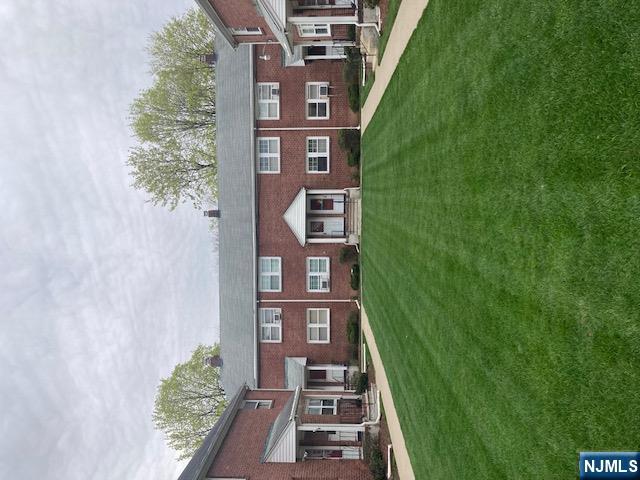 1288 Teaneck Road, Unit 3 Teaneck, NJ 07666 - Photo 3 of 17 a front view of a house with a garden and porch
