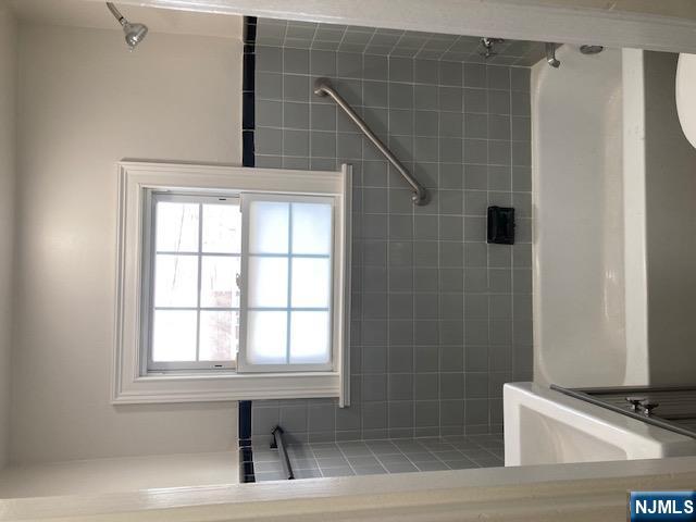 1288 Teaneck Road, Unit 3 Teaneck, NJ 07666 - Photo 8 of 17 a bathroom with a bathtub and shower