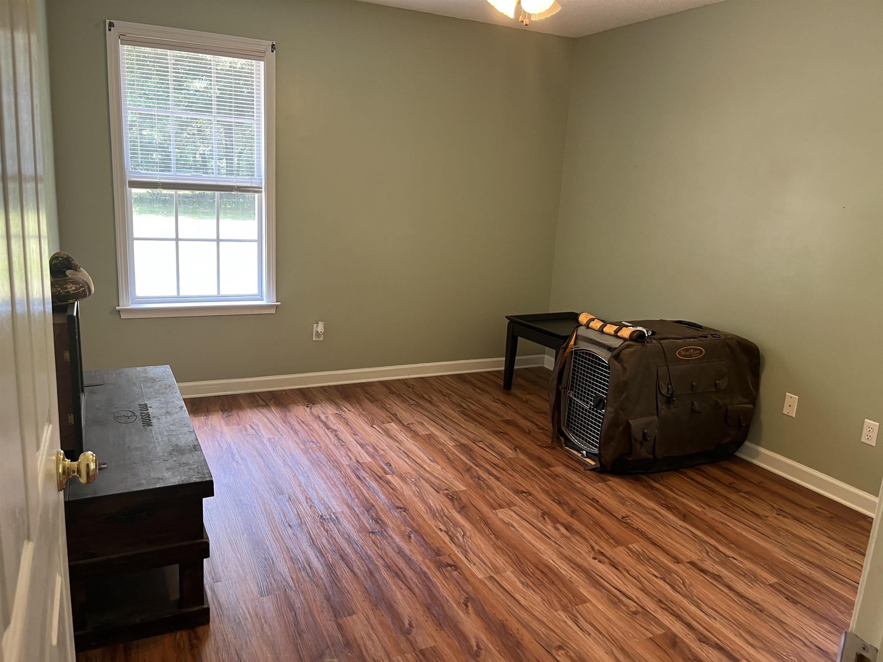 8611 Deadfall Road Millington, TN 38053 - Photo 18 of 25 a room with wooden floor and a window
