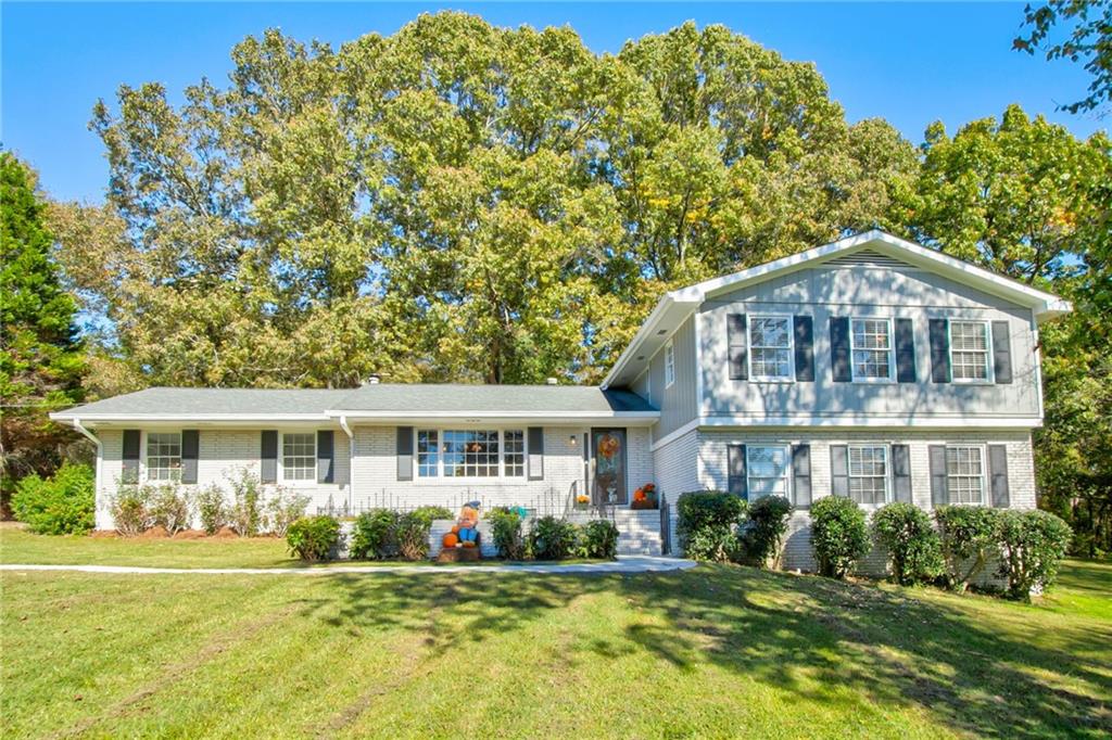 a front view of a house with a yard