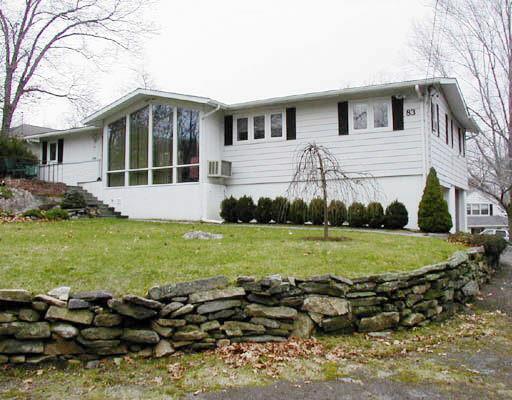 83 Cognewaugh Road Greenwich, CT 06807 - Photo 1 of 1 a view of a house with a yard