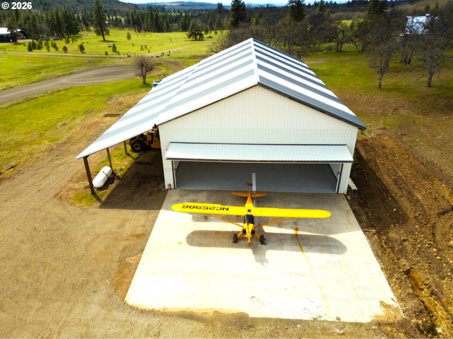 287 Munson Prairie Road Goldendale, WA 98620 - Photo 13 of 48 a view of a swimming pool with an outdoor space and seating area