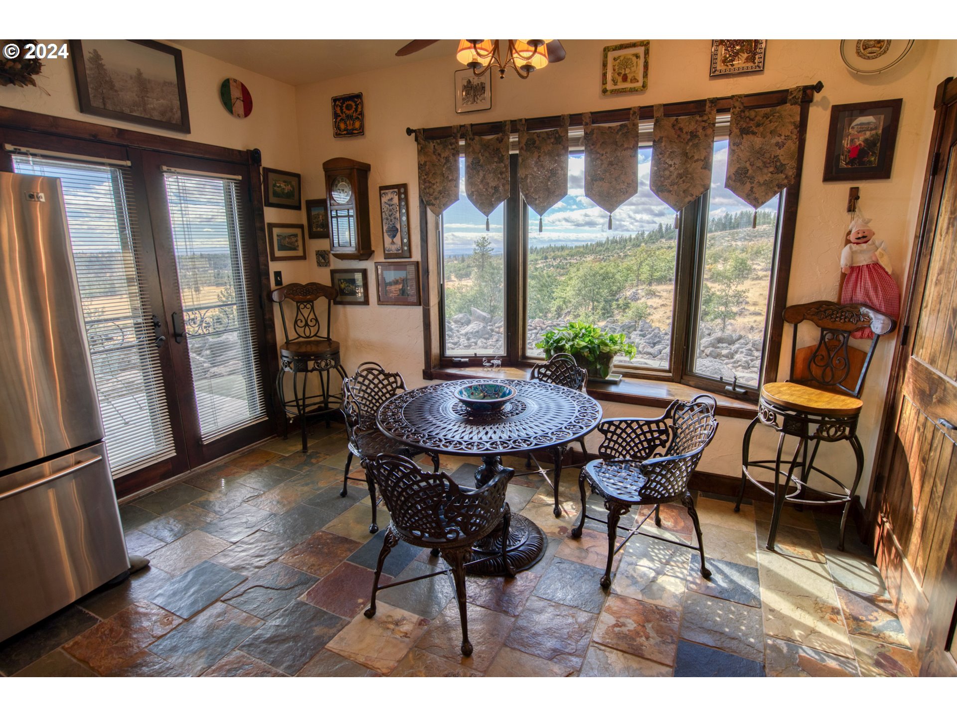 287 Munson Prairie Road Goldendale, WA 98620 - Photo 24 of 48 a view of a dining room with furniture window and wooden floor