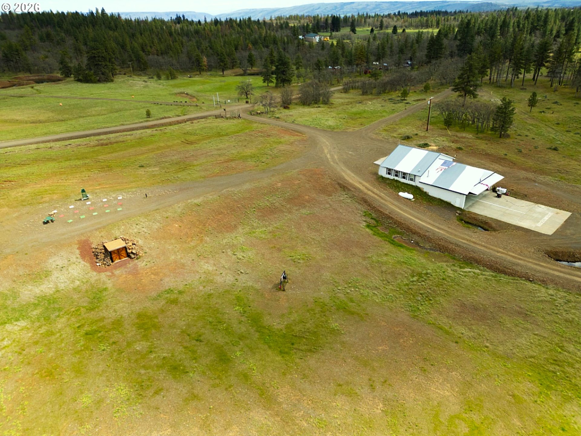 287 Munson Prairie Road Goldendale, WA 98620 - Photo 6 of 48 a view of a lake with a yard