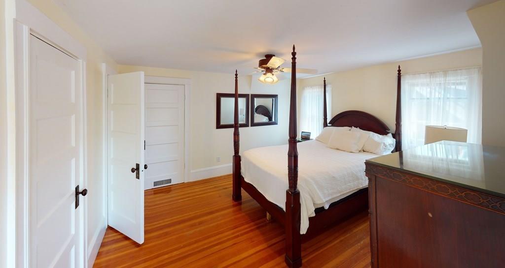 89 Spring Street Stoneham, MA 02180 - Photo 12 of 29 a bedroom with a bed and a dresser