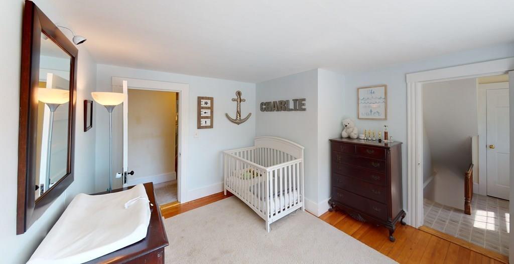 89 Spring Street Stoneham, MA 02180 - Photo 14 of 29 a bedroom with furniture and a window