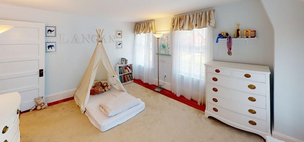 89 Spring Street Stoneham, MA 02180 - Photo 15 of 29 a bedroom with furniture and a wooden floor