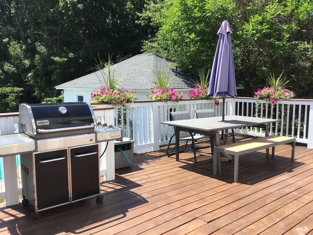 89 Spring Street Stoneham, MA 02180 - Photo 19 of 29 a view of a kitchen with a deck and a patio