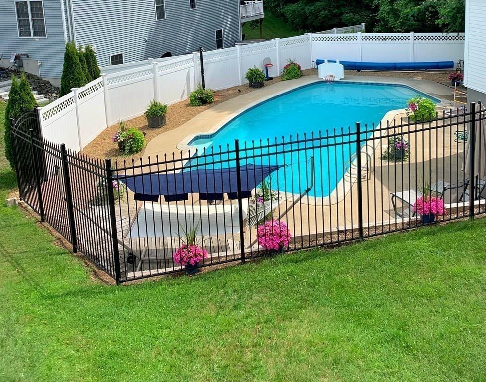 89 Spring Street Stoneham, MA 02180 - Photo 20 of 29 a view of swimming pool with garden and deck