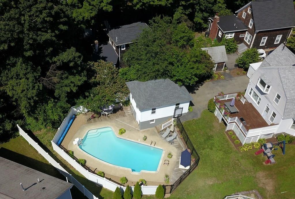 89 Spring Street Stoneham, MA 02180 - Photo 25 of 29 an aerial view of residential house with outdoor space and swimming pool