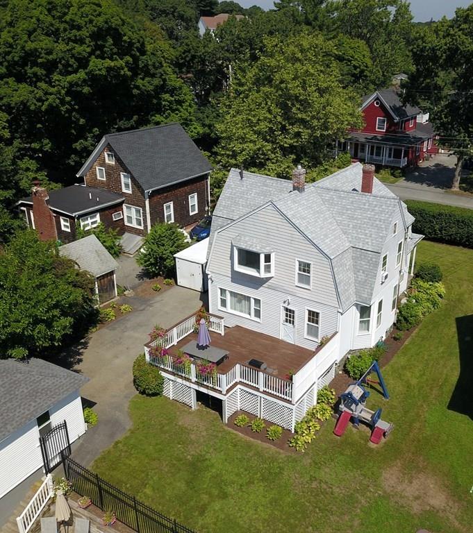 89 Spring Street Stoneham, MA 02180 - Photo 26 of 29 a aerial view of a house with table and chairs