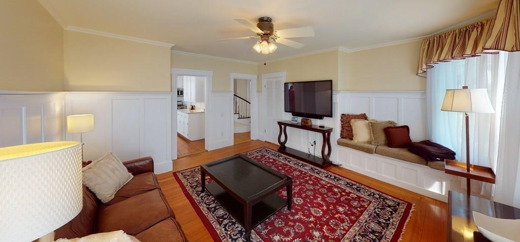 89 Spring Street Stoneham, MA 02180 - Photo 5 of 29 a living room with furniture and a flat screen tv