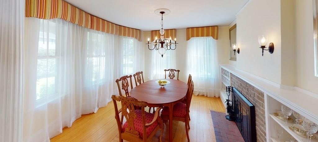 89 Spring Street Stoneham, MA 02180 - Photo 6 of 29 a dining room with furniture window and wooden floor