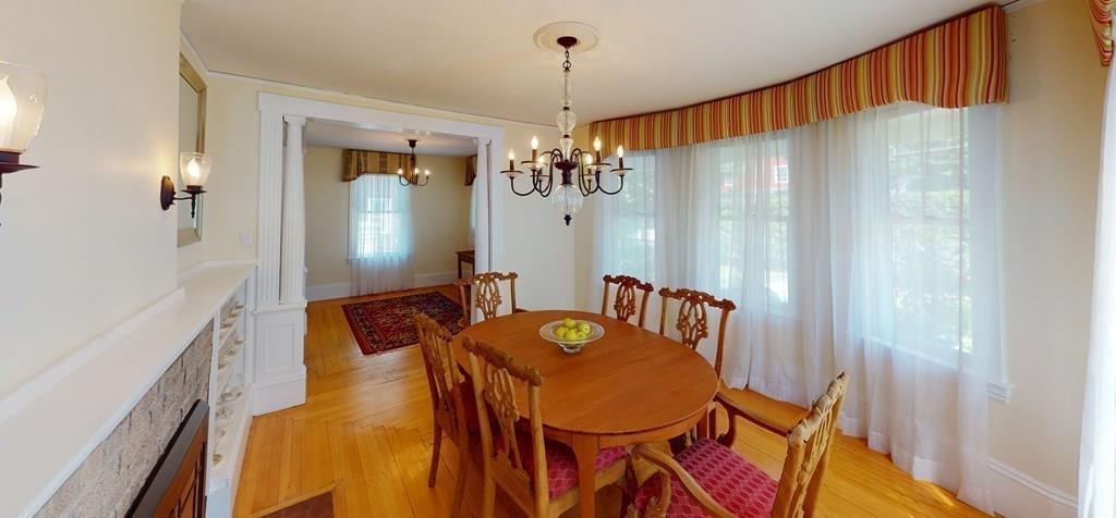 89 Spring Street Stoneham, MA 02180 - Photo 7 of 29 a view of a dining room with furniture and chandelier