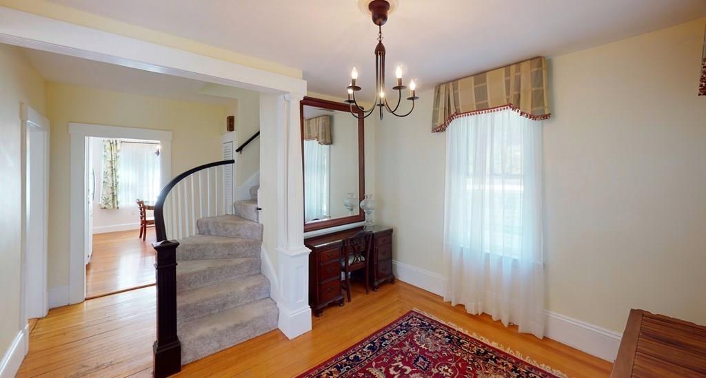 89 Spring Street Stoneham, MA 02180 - Photo 8 of 29 a view of entryway and hall with wooden floor