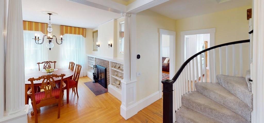 89 Spring Street Stoneham, MA 02180 - Photo 9 of 29 workspace with wooden floor stairs and windows