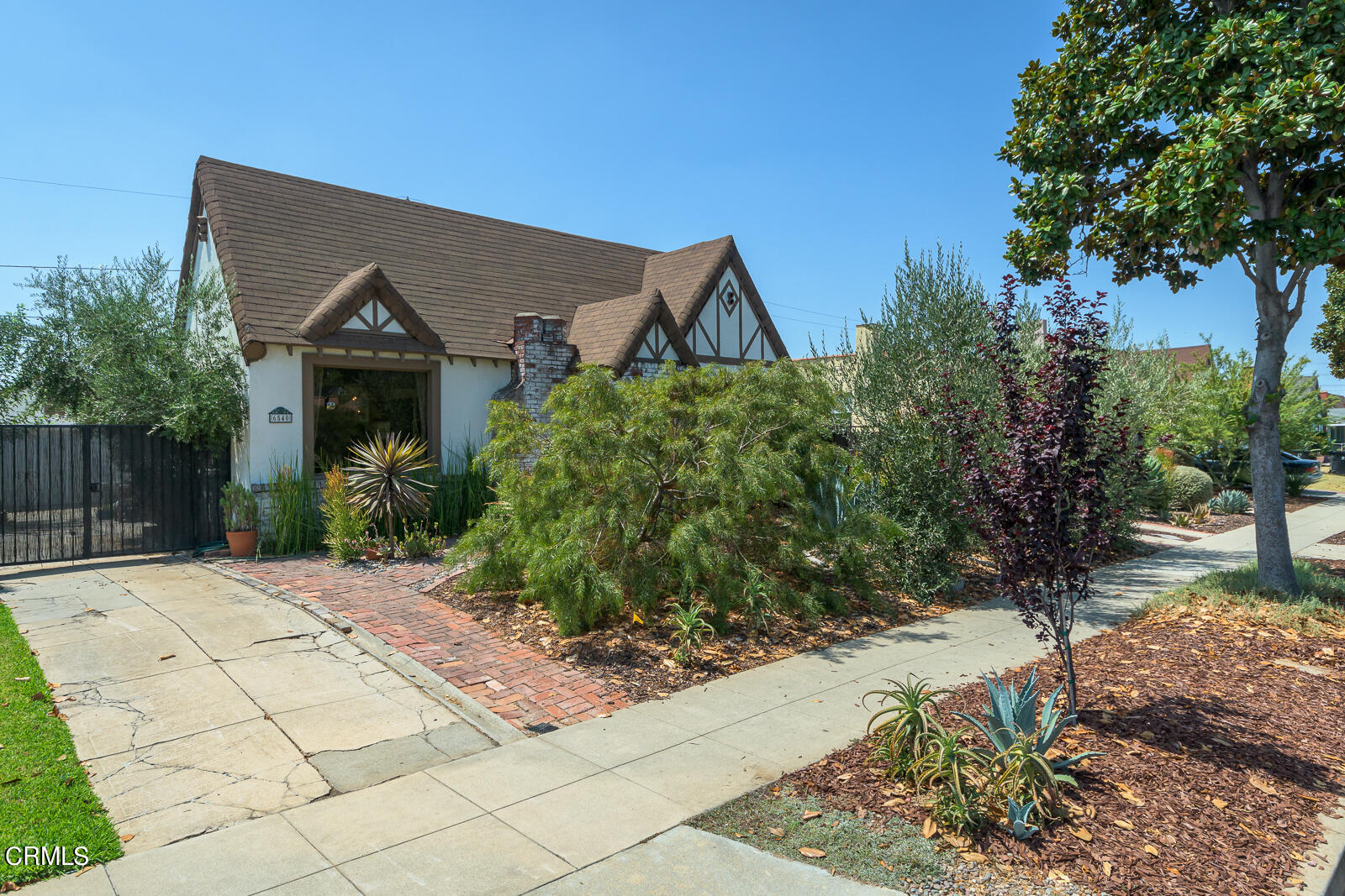 6540 Northside Drive Los Angeles, CA 90022 - Photo 1 of 54 a front view of a house with a yard