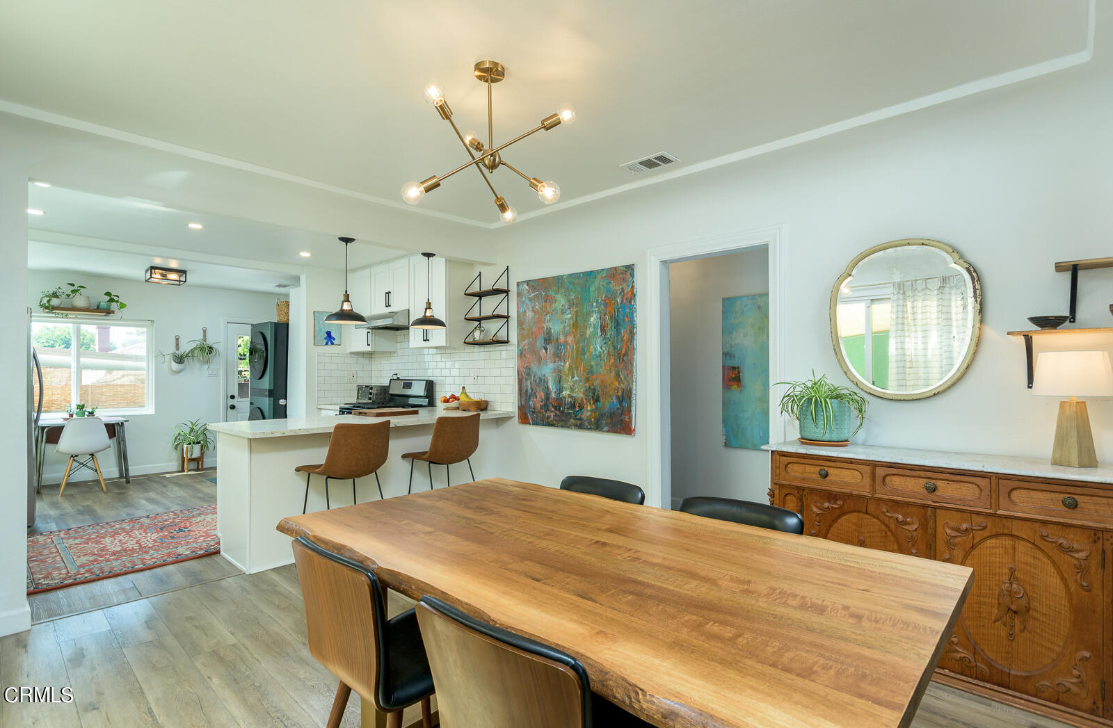 6540 Northside Drive Los Angeles, CA 90022 - Photo 11 of 54 a kitchen with a table and chairs in it