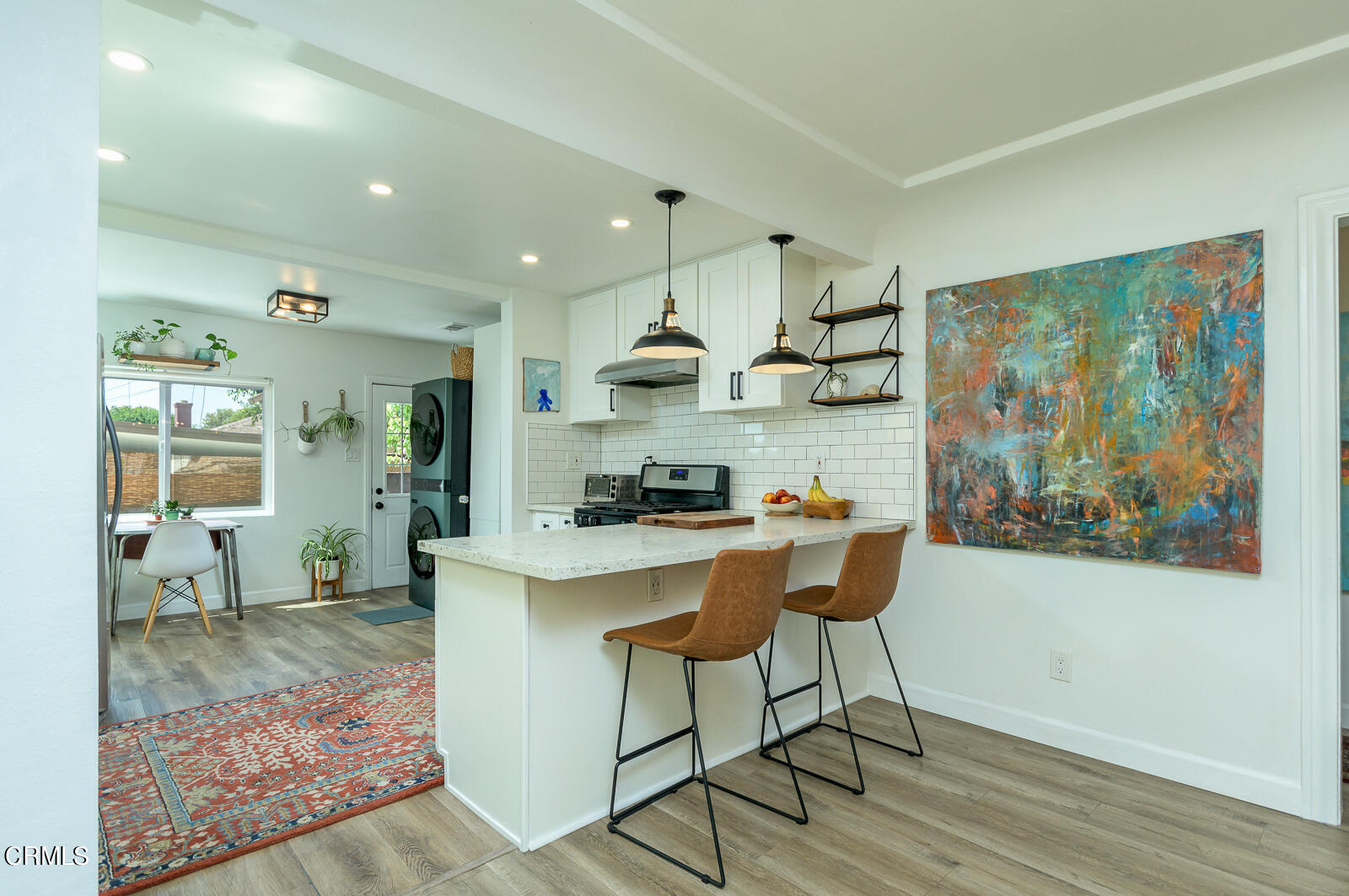 6540 Northside Drive Los Angeles, CA 90022 - Photo 15 of 54 a kitchen with stainless steel appliances granite countertop a stove a sink and a refrigerator