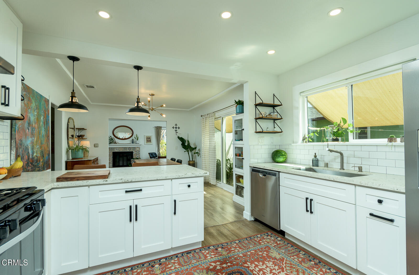6540 Northside Drive Los Angeles, CA 90022 - Photo 20 of 54 a kitchen with white cabinets and sink