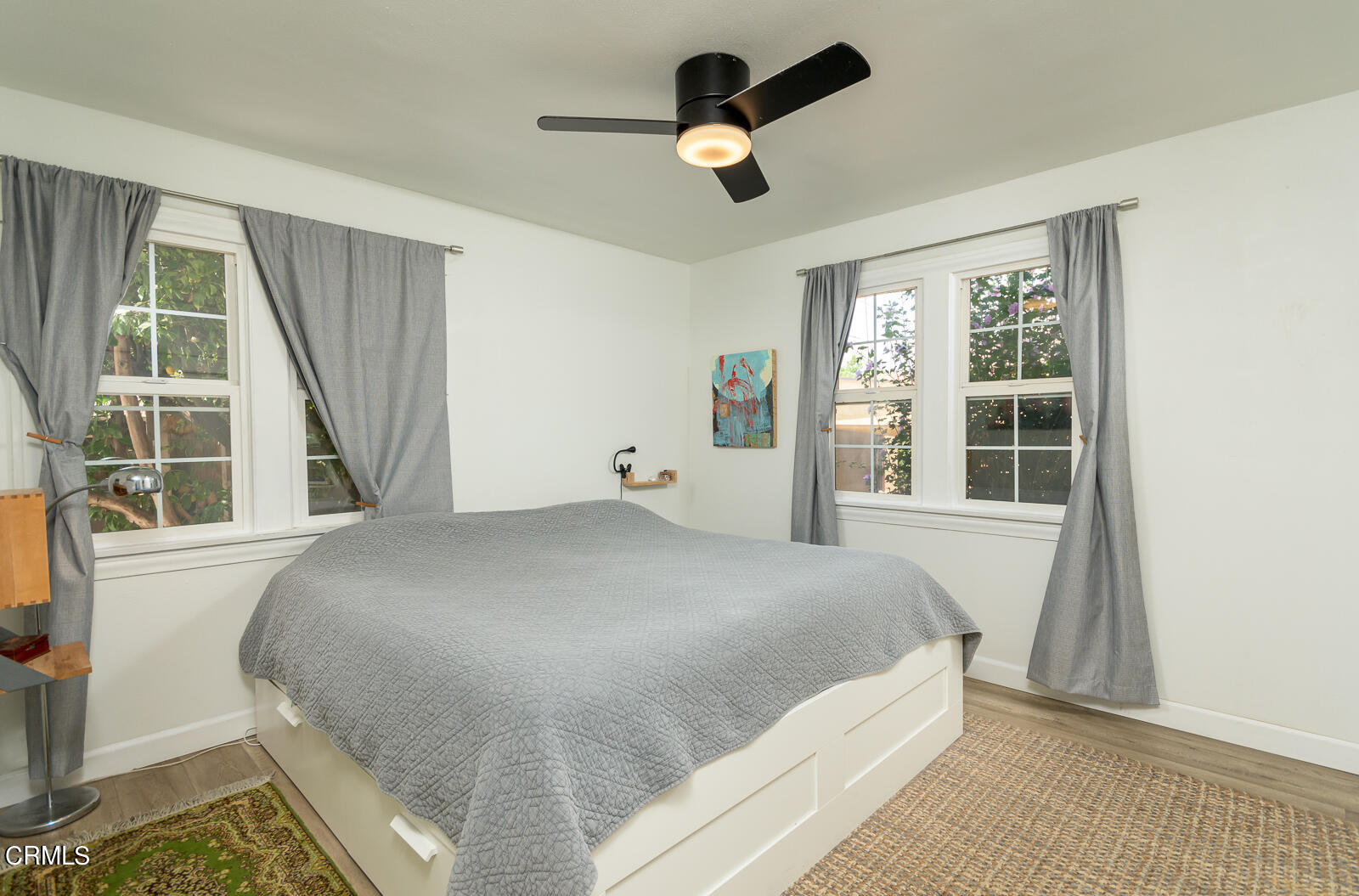 6540 Northside Drive Los Angeles, CA 90022 - Photo 22 of 54 a large bed sitting in a bedroom next to a window