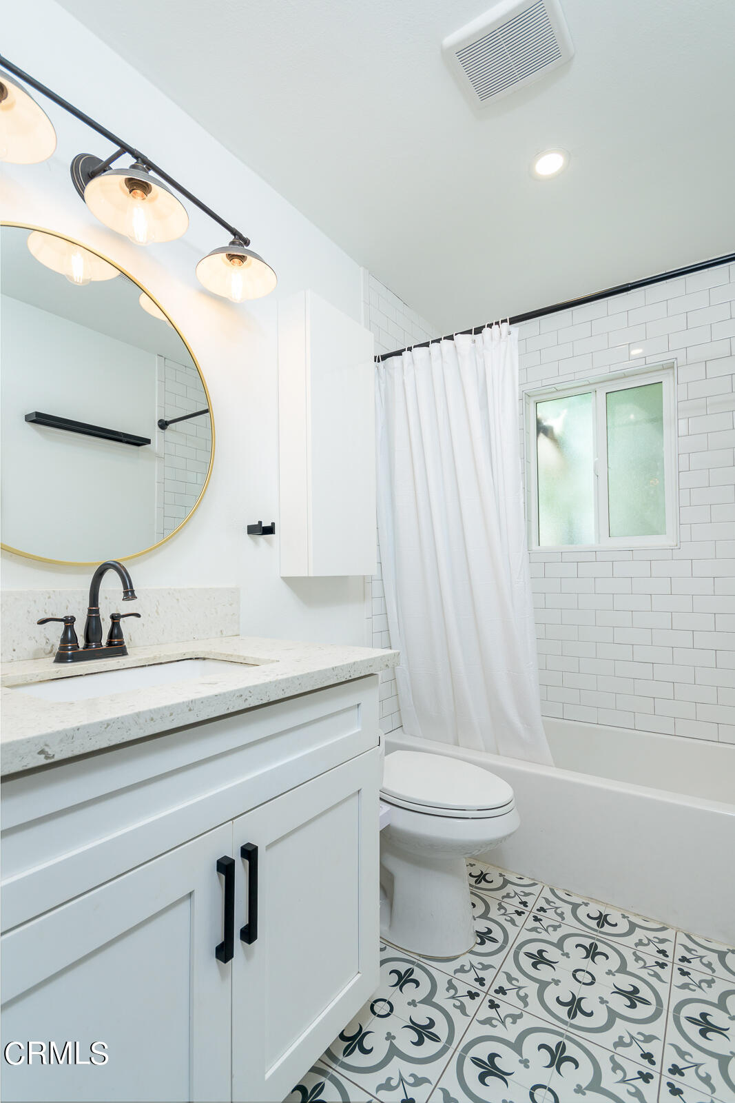 6540 Northside Drive Los Angeles, CA 90022 - Photo 27 of 54 a bathroom with a sink a toilet and shower