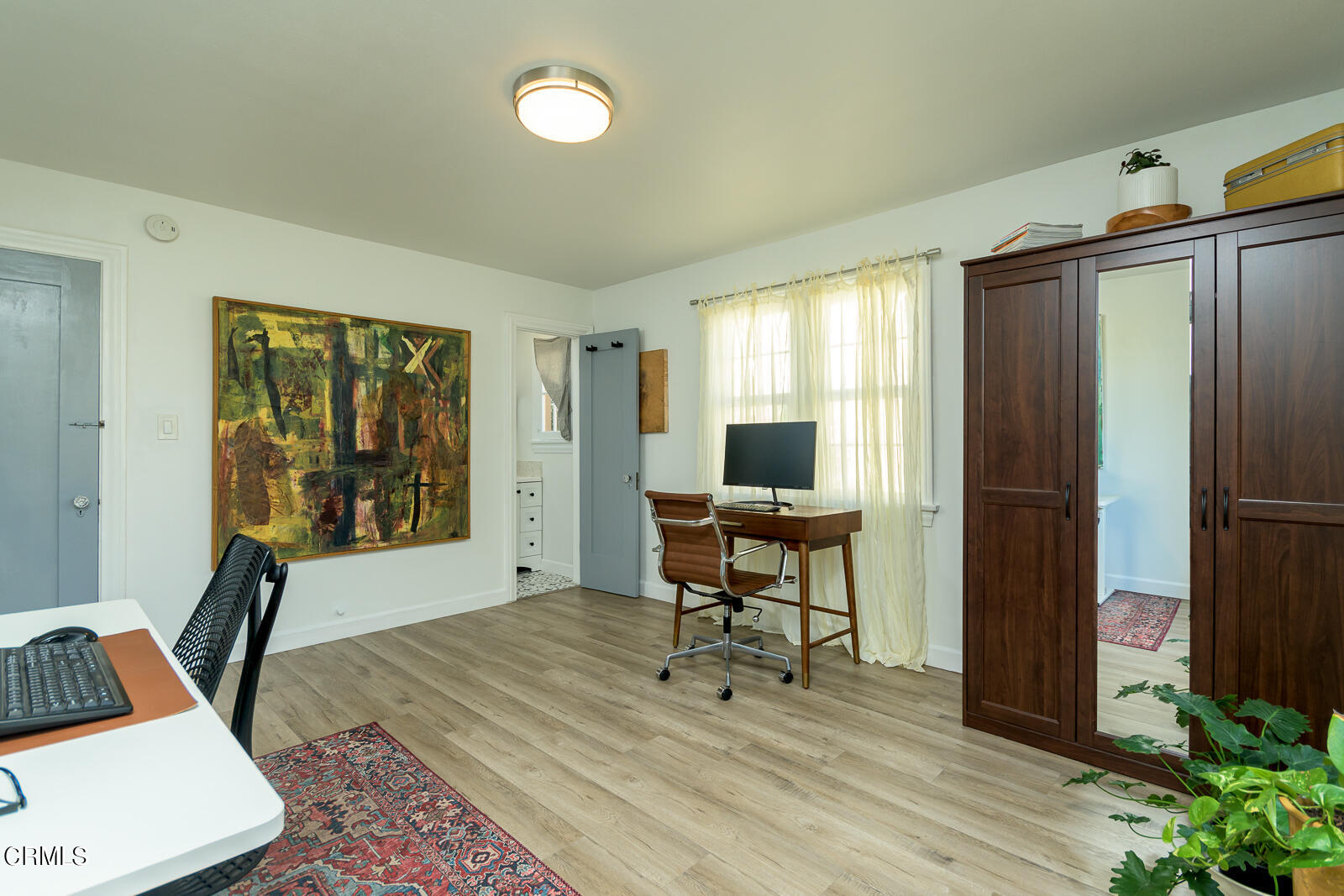 6540 Northside Drive Los Angeles, CA 90022 - Photo 30 of 54 a living room with furniture a window and a flat screen tv