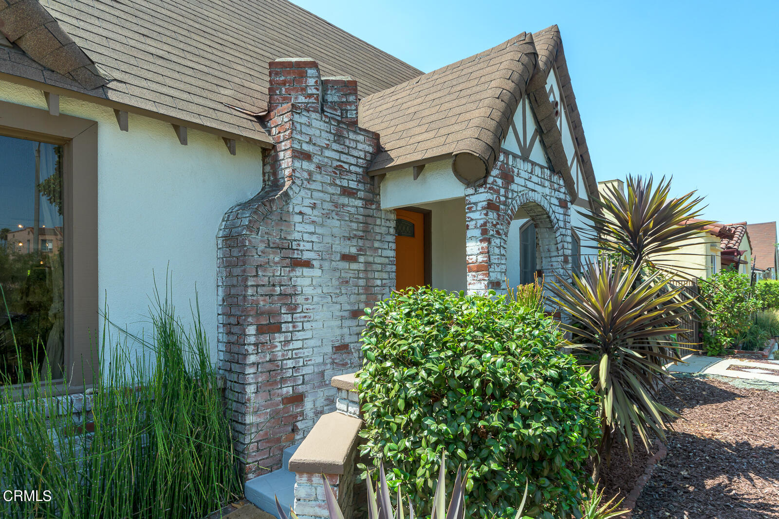 6540 Northside Drive Los Angeles, CA 90022 - Photo 3 of 54 a front view of a house with a garden