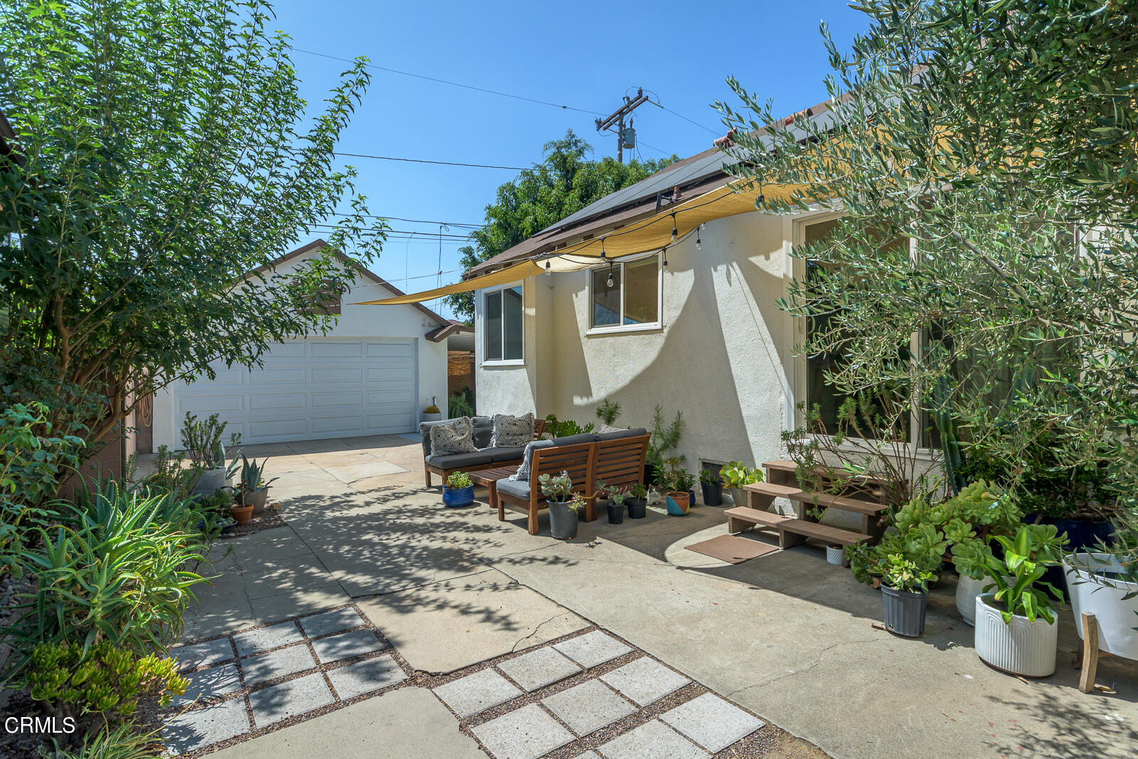 6540 Northside Drive Los Angeles, CA 90022 - Photo 34 of 54 a backyard of a house with outdoor seating