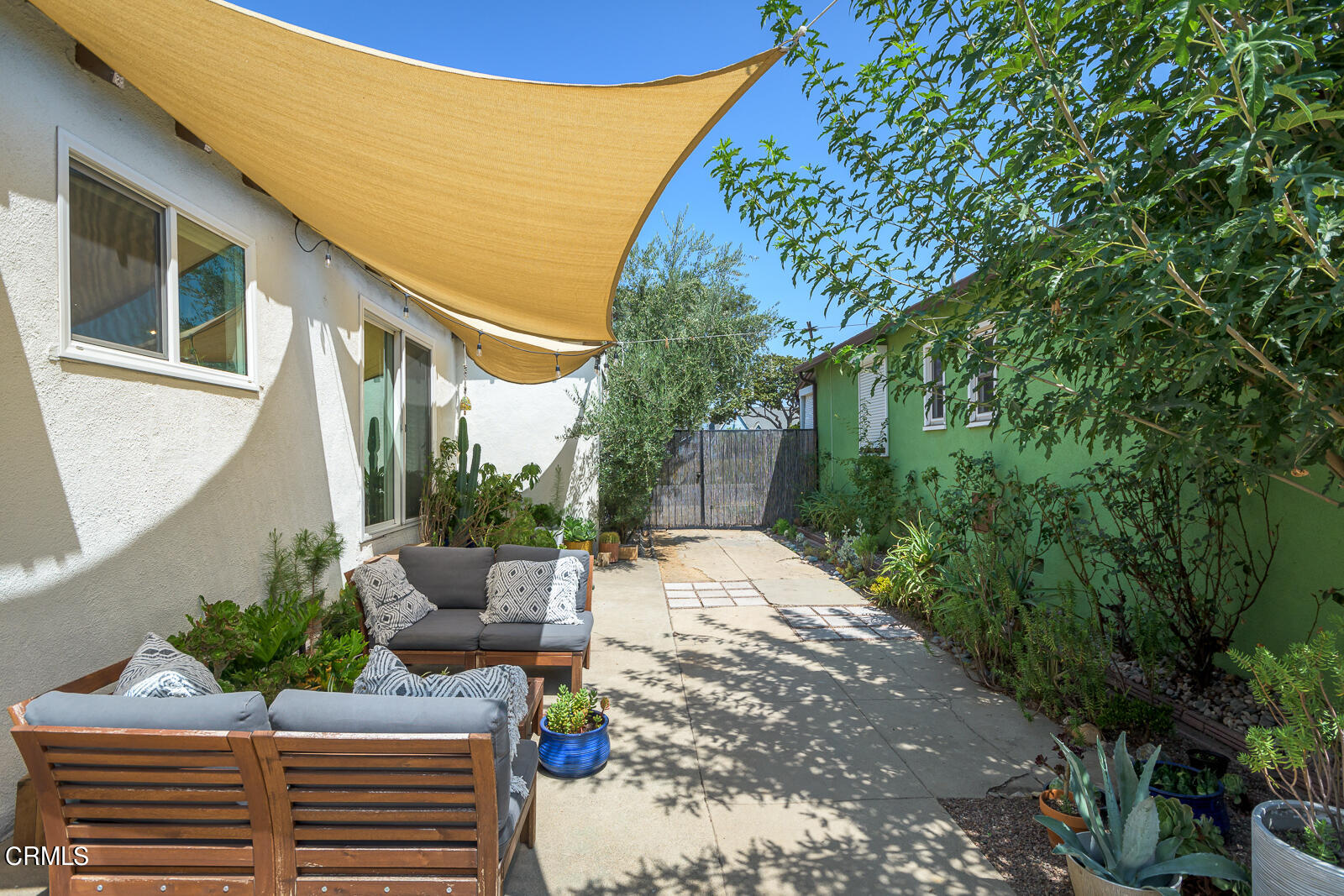 6540 Northside Drive Los Angeles, CA 90022 - Photo 35 of 54 a view of a patio with table and chairs and potted plants