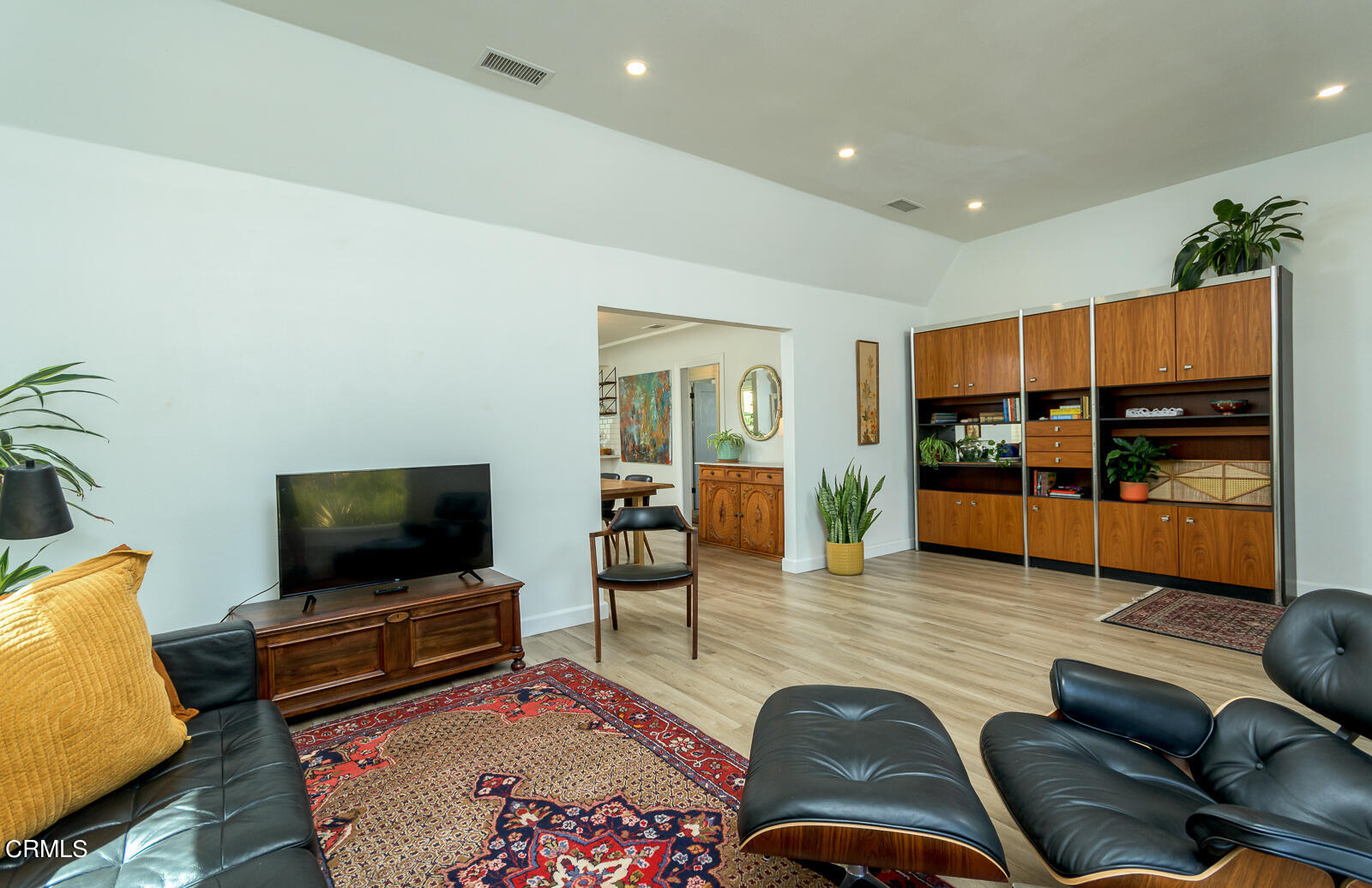 6540 Northside Drive Los Angeles, CA 90022 - Photo 8 of 54 a living room with furniture and a flat screen tv