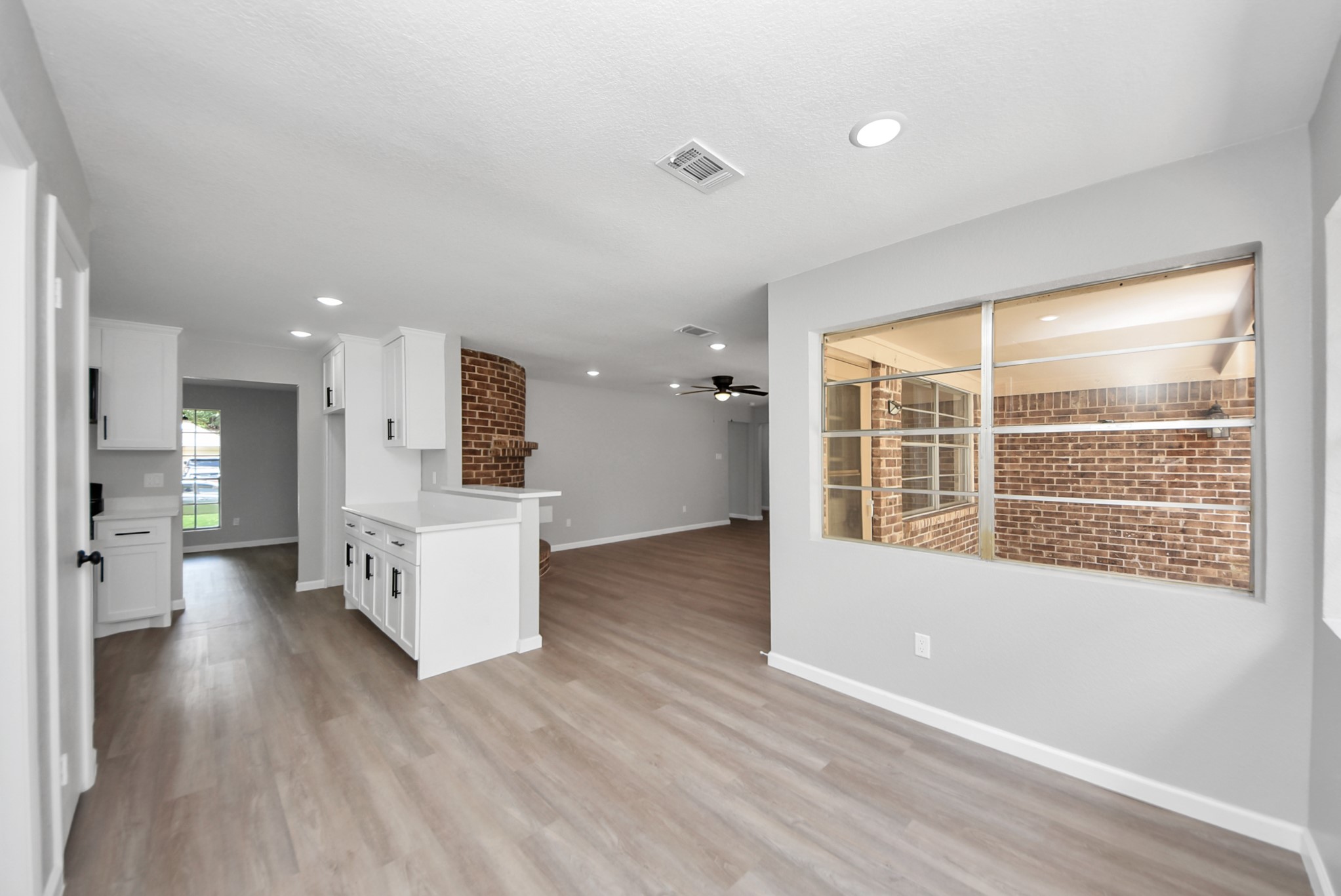 2402 Rolling Glen Drive Spring, TX 77373 - Photo 6 of 38 a view of an empty room with wooden floor and a window