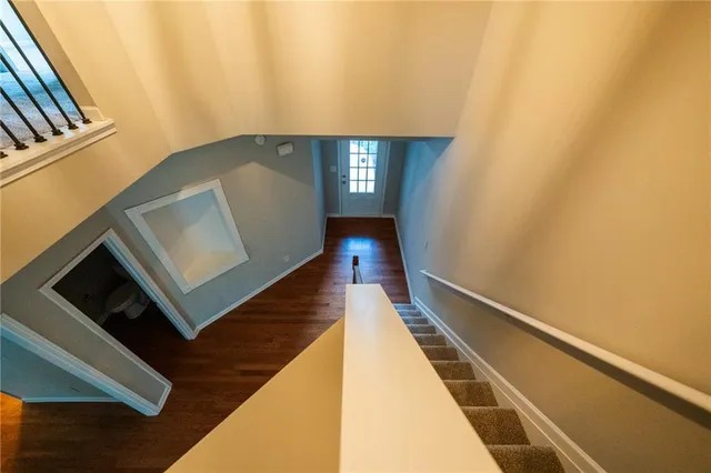 a view of an entryway with wooden floor