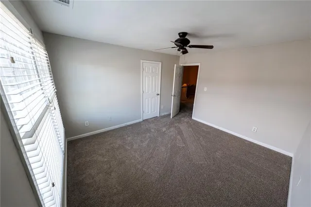 a view of an empty room and closet