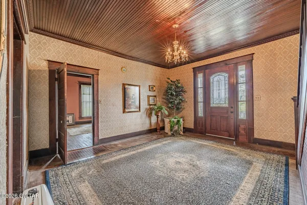 a view of entryway with wooden floor