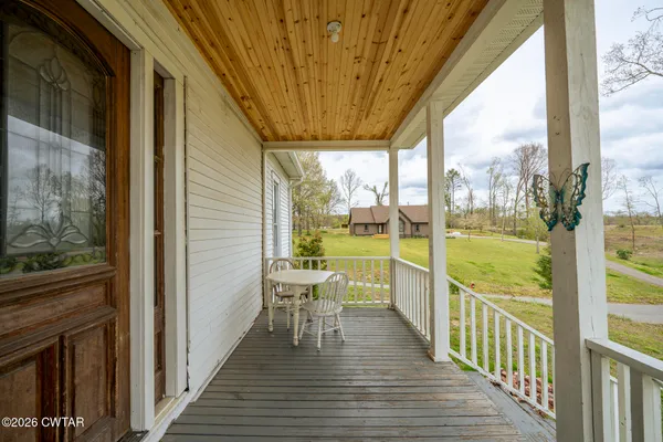 a view of a balcony with chairs
