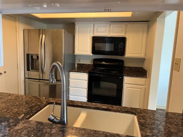 a kitchen with a stove and a microwave