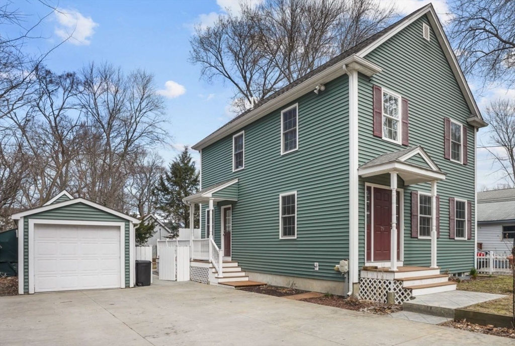 79 Coral Road North Attleboro, MA 02760 - Photo 1 of 14 a view of a house with a yard and garage