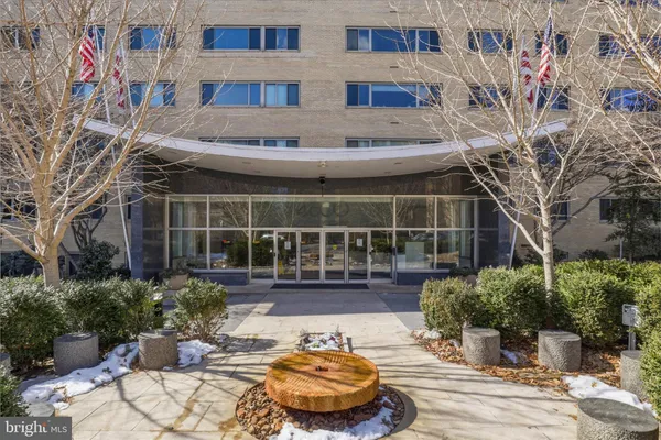 a view of a swimming pool with furniture