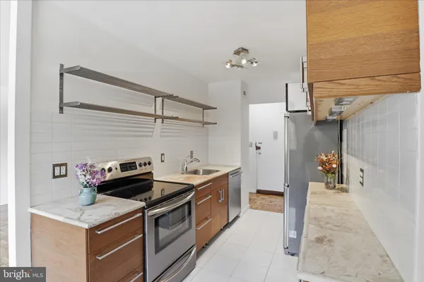 a kitchen that has a stove and a table